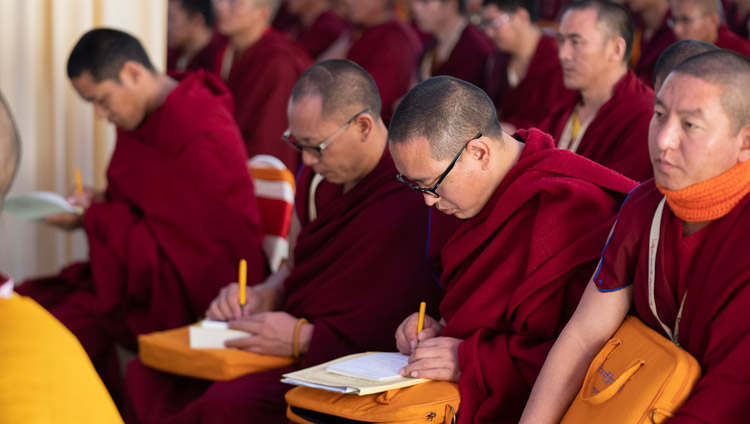 Members of the audience taking notes during His Holiness the Dalai Lama's address at the Conference on Tsongkhapa's ‘Essence of True Eloquence’ in Bodhgaya, Bihar, India on December 19, 2018. Photo by Lobsang Tsering Members of the audience taking notes during His Holiness the Dalai Lama's address at the Conference on Tsongkhapa's ‘Essence of True Eloquence’ in Bodhgaya, Bihar, India on December 19, 2018. Photo by Lobsang Tsering