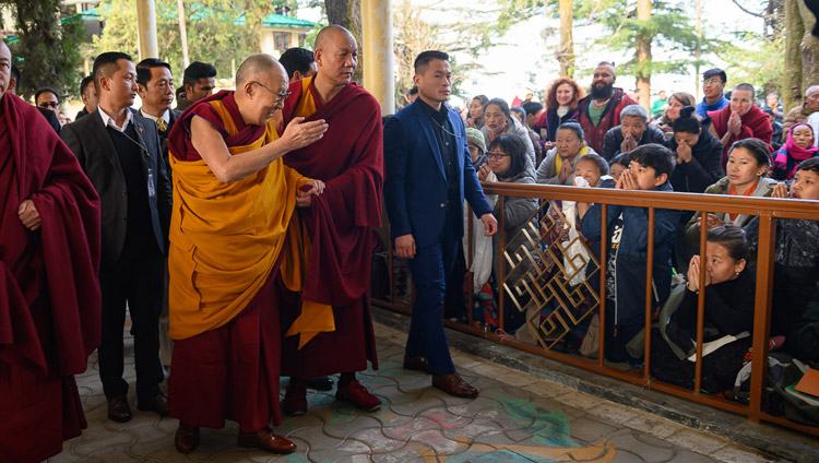 His Holiness the Dalai Lama greeting members of the crowd in the Main Tibetan Temple courtyard on the first day of his teaching on Bhavaviveka's "Essence of the Middle Way" in Dharamsala, HP, India on February 20, 2019. Photo by Tenzin Choejor His Holiness the Dalai Lama greeting members of the crowd in the Main Tibetan Temple courtyard on the first day of his teaching on Bhavaviveka's "Essence of the Middle Way" in Dharamsala, HP, India on February 20, 2019. Photo by Tenzin Choejor