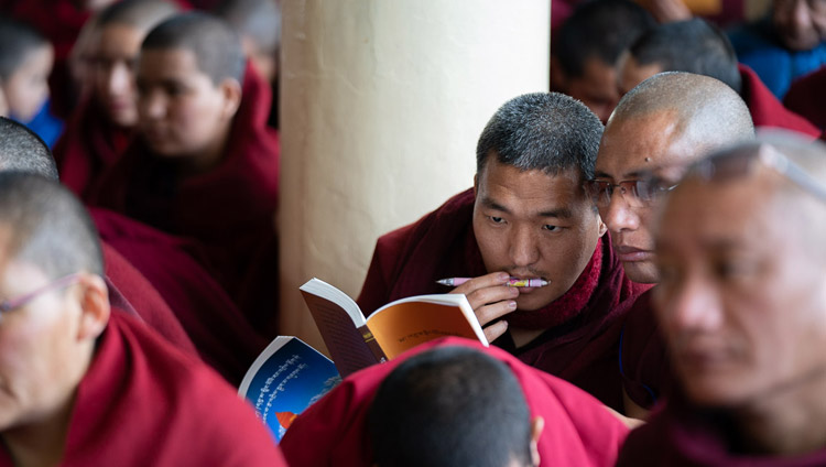 Monks in the audience following the text as His Holiness the Dalai Lama reads from Bhavaviveka's "Essence of the Middle Way" on the first day of his teachings at the Main Tibetan Temple in Dharamsala, HP, India on February 20, 2019. Photo by Tenzin Choejor Monks in the audience following the text as His Holiness the Dalai Lama reads from Bhavaviveka's "Essence of the Middle Way" on the first day of his teachings at the Main Tibetan Temple in Dharamsala, HP, India on February 20, 2019. Photo by Tenzin Choejor