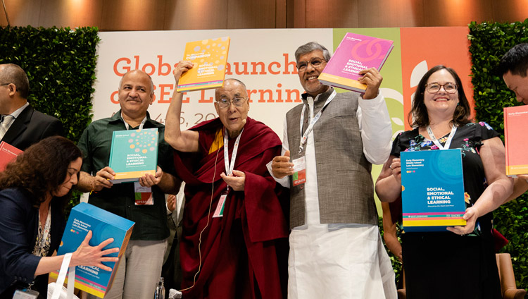 His Holiness the Dalai Lama with Delhi Deputy Chief Minister Manish Sisodia and Nobel Peace Laureate Kailash Satyarthi holding the SEE Learning curriculum text books in New Delhi, India on April 5, 2019. Photo by Tenzin Choejor His Holiness the Dalai Lama with Delhi Deputy Chief Minister Manish Sisodia and Nobel Peace Laureate Kailash Satyarthi holding the SEE Learning curriculum text books in New Delhi, India on April 5, 2019. Photo by Tenzin Choejor