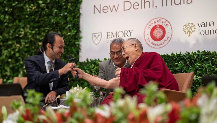 His Holiness the Dalai Lama playfully handing Brendan Ozawa-de Silva his microphone during the panel discussion at the global launch of SEE Learning in New Delhi, India on April 5, 2019. Photo by Tenzin Choejor His Holiness the Dalai Lama playfully handing Brendan Ozawa-de Silva his microphone during the panel discussion at the global launch of SEE Learning in New Delhi, India on April 5, 2019. Photo by Tenzin Choejor