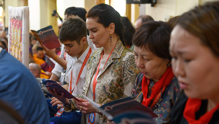 Members of the audience reciting prayers at the start of the second day of His Holiness the Dalai Lama's teaching at the request of Russian Buddhists at the Main Tibetan Temple in Dharamsala, HP, India on May 11, 2019. Photo by Tenzin Choejor Members of the audience reciting prayers at the start of the second day of His Holiness the Dalai Lama's teaching at the request of Russian Buddhists at the Main Tibetan Temple in Dharamsala, HP, India on May 11, 2019. Photo by Tenzin Choejor