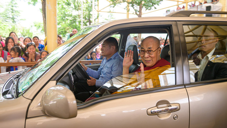 His Holiness the Dalai Lama waving to members of the crowd as he leaves the Main Tibetan Temple courtyard for his residence at the conclusion of his teaching for young Tibetans in Dharamsala, HP, India on June 3, 2019. Photo by Tenzin Choejor His Holiness the Dalai Lama waving to members of the crowd as he leaves the Main Tibetan Temple courtyard for his residence at the conclusion of his teaching for young Tibetans in Dharamsala, HP, India on June 3, 2019. Photo by Tenzin Choejor