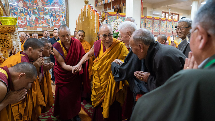 His Holiness the Dalai Lama greeting retired CTA officials as he arrives inside the Main Tibetan Temple in Dharamsala, HP, India on July 5, 2019. Photo by Tenzin Choejor His Holiness the Dalai Lama greeting retired CTA officials as he arrives inside the Main Tibetan Temple in Dharamsala, HP, India on July 5, 2019. Photo by Tenzin Choejor