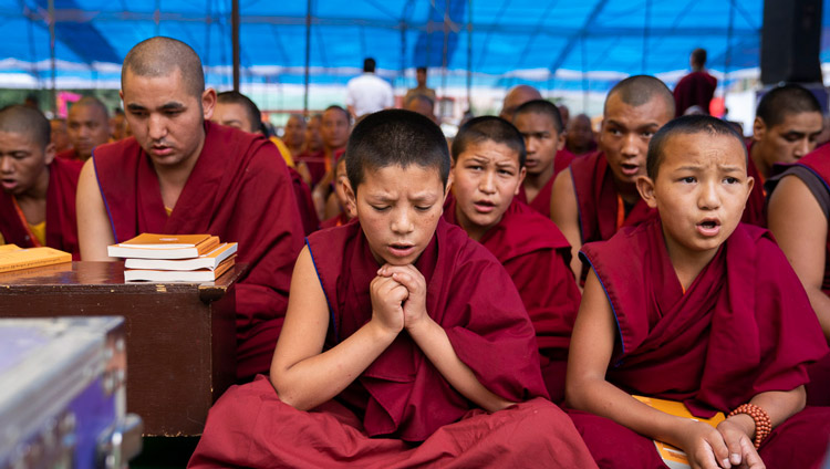 Young monks reciting prayers during the first day of His Holiness the Dalai Lama's teachings in Manali, HP, India on August 13, 2019. Photo by Tenzin Choejor Young monks reciting prayers during the first day of His Holiness the Dalai Lama's teachings in Manali, HP, India on August 13, 2019. Photo by Tenzin Choejor