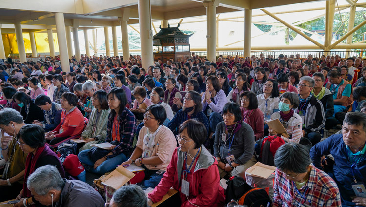 Members of the audience sitting on the veranda of the Main Tibetan Temple listening to His Holiness the Dalai Lama on the first day of his teachings in Dharamsala, HP, India on October 3, 2019. Photo by Ven Tenzin Jamphel Members of the audience sitting on the veranda of the Main Tibetan Temple listening to His Holiness the Dalai Lama on the first day of his teachings in Dharamsala, HP, India on October 3, 2019. Photo by Ven Tenzin Jamphel