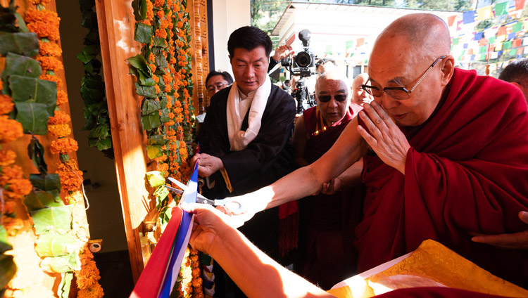 His Holiness the Dalai Lama cutting a ribbon to inaugurate the Tibetan Institute of Performing Arts' new auditorium in Dharamsala, India on October 29, 2019. Photo by Tenzin Choejor His Holiness the Dalai Lama cutting a ribbon to inaugurate the Tibetan Institute of Performing Arts' new auditorium in Dharamsala, India on October 29, 2019. Photo by Tenzin Choejor