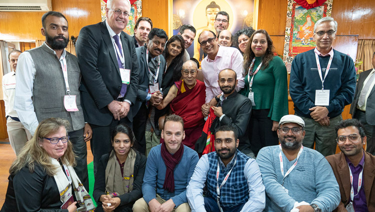 His Holiness the Dalai Lama posing for a group photo with delegates to the Rising Himachal Global Investors' Meet after their meeting at his residence in Dharamsala, HP, India on November 8, 2019. Photo by Tenzin Choejor His Holiness the Dalai Lama posing for a group photo with delegates to the Rising Himachal Global Investors' Meet after their meeting at his residence in Dharamsala, HP, India on November 8, 2019. Photo by Tenzin Choejor