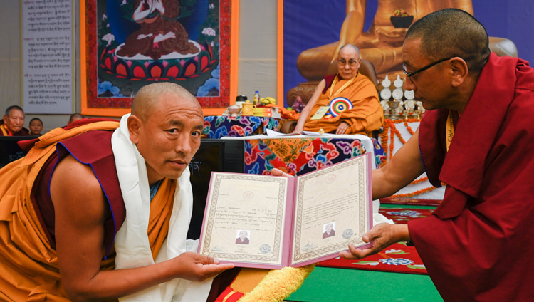 Karma Gelek Yuthok, Kalon for Religion & Culture presenting Certificates of Graduation at the Symposium on Monastic Education to mark the 25th anniversary of Kirti Jepa Dratsang in Dharamsala, HP, India on December 7, 2019. Photo by Manuel Bauer Karma Gelek Yuthok, Kalon for Religion & Culture presenting Certificates of Graduation at the Symposium on Monastic Education to mark the 25th anniversary of Kirti Jepa Dratsang in Dharamsala, HP, India on December 7, 2019. Photo by Manuel Bauer