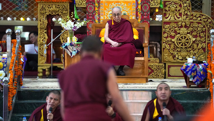 His Holiness the Dalai Lama listening attentively to monks debating Buddhist philosophy at Drepung Gomang Assembly Hall in Mundgod, Karnataka, India on December 15, 2019. Photo by Lobsang Tsering