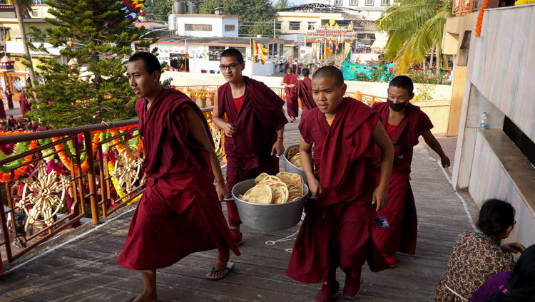 Young monks carry bread to distribute to the over 5,000 people attending the Long Life Offering for His Holiness the Dalai Lama at Gaden Jangtse Monastery in Mundgod, Karnataka, India on December 22, 2019. Photo by Lobsang Tsering Young monks carry bread to distribute to the over 5,000 people attending the Long Life Offering for His Holiness the Dalai Lama at Gaden Jangtse Monastery in Mundgod, Karnataka, India on December 22, 2019. Photo by Lobsang Tsering