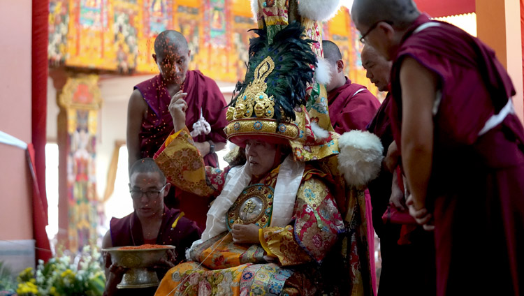 Nechung Oracle tossing blessed barley seeds in the air during the Long Life Offering for His Holiness the Dalai Lama at Gaden Jangtse Monastery in Mundgod, Karnataka, India on December 22, 2019. Photo by Lobsang Tsering Nechung Oracle tossing blessed barley seeds in the air during the Long Life Offering for His Holiness the Dalai Lama at Gaden Jangtse Monastery in Mundgod, Karnataka, India on December 22, 2019. Photo by Lobsang Tsering