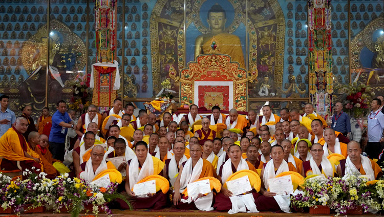 His Holiness the Dalai Lama posing for group photos with newly graduated Geshe Lharamapas at Gaden Jangtse Monastery in Mundgod, Karnataka, India on December 22, 2019. Photo by Lobsang Tsering His Holiness the Dalai Lama posing for group photos with newly graduated Geshe Lharamapas at Gaden Jangtse Monastery in Mundgod, Karnataka, India on December 22, 2019. Photo by Lobsang Tsering