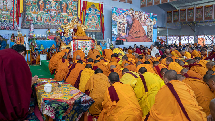 Geshes filling the stage in front of His Holiness the Dalai Lama to get protection from the rain at the Kalachakra Ground in Bodhgaya, Bihar, India on January 3, 2020. Photo by Tenzin Choejor Geshes filling the stage in front of His Holiness the Dalai Lama to get protection from the rain at the Kalachakra Ground in Bodhgaya, Bihar, India on January 3, 2020. Photo by Tenzin Choejor