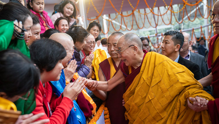 His Holiness the Dalai Lama greeting members of the crowd as he arrives at the Kalachakra Ground in Bodhgaya, Bihar, India on January 5, 2020. Photo by Tenzin Choejor His Holiness the Dalai Lama greeting members of the crowd as he arrives at the Kalachakra Ground in Bodhgaya, Bihar, India on January 5, 2020. Photo by Tenzin Choejor