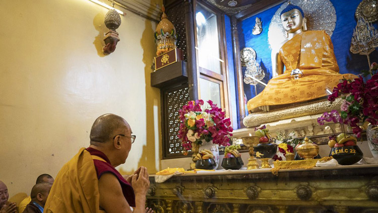 His Holiness the Dalai Lama paying his respects before the statue of the Buddha inside the stupa at the Mahabodhi Temple in Bodhgaya, Bihar, India on January 17, 2020. Photo by Tenzin Choejor His Holiness the Dalai Lama paying his respects before the statue of the Buddha inside the stupa at the Mahabodhi Temple in Bodhgaya, Bihar, India on January 17, 2020. Photo by Tenzin Choejor