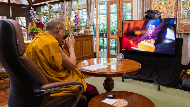 A member of the audience in Taiwan holding a birthday cake for His Holiness the Dalai Lama at the conclusion of his short teaching on Mind Training by video link from his residence in Dharamsala, HP, India on July 5, 2020. A member of the audience in Taiwan holding a birthday cake for His Holiness the Dalai Lama at the conclusion of his short teaching on Mind Training by video link from his residence in Dharamsala, HP, India on July 5, 2020.