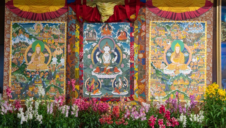 The central figure in these thangka paintings hanging behind His Holiness is the four armed Avalokiteshvara described in the Guru Yoga of Avalokiteshvara, the transmission of which he gave on the final day of his teachings from his residence in Dharamsala, HP, India on January 7, 2021. Photo by Ven Tenzin Jamphel The central figure in these thangka paintings hanging behind His Holiness is the four armed Avalokiteshvara described in the Guru Yoga of Avalokiteshvara, the transmission of which he gave on the final day of his teachings from his residence in Dharamsala, HP, India on January 7, 2021. Photo by Ven Tenzin Jamphel
