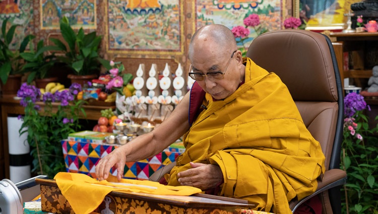 His Holiness the Dalai Lama reading from Tsongkhapa's "Three Principal Aspects of the Path" during his teachings online from his residence in Dharamsala, HP, India on May 26, 2021. Photo by Ven Tenzin Jamphel His Holiness the Dalai Lama reading from Tsongkhapa's "Three Principal Aspects of the Path" during his teachings online from his residence in Dharamsala, HP, India on May 26, 2021. Photo by Ven Tenzin Jamphel