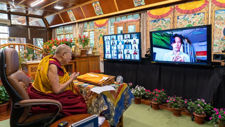 A member of the virtual audience making a traditional mandala offering at the start of His Holiness the Dalai Lama's online conversation with Indonesian students from his residence in Dharamsala, HP, India on August 11, 2021. Photo by Ven Tenzin Jamphel A member of the virtual audience making a traditional mandala offering at the start of His Holiness the Dalai Lama's online conversation with Indonesian students from his residence in Dharamsala, HP, India on August 11, 2021. Photo by Ven Tenzin Jamphel