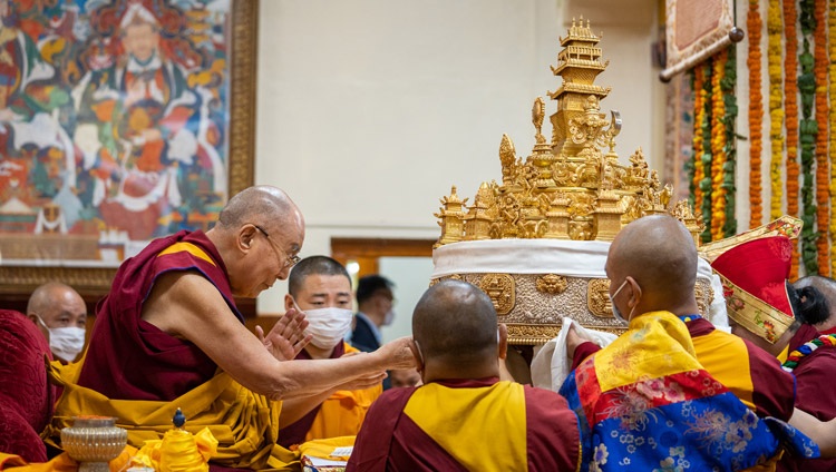 The incumbent Sakya Throne-holder, the Sakya Trizin, Gyana Vajra Rinpoché offering His Holiness the Dalai Lama a large mandala during the Long Life Offering at the Main Tibetan Temple in Dharamsala, HP, India on May 25, 2022. Photo by Tenzin Choejor The incumbent Sakya Throne-holder, the Sakya Trizin, Gyana Vajra Rinpoché offering His Holiness the Dalai Lama a large mandala during the Long Life Offering at the Main Tibetan Temple in Dharamsala, HP, India on May 25, 2022. Photo by Tenzin Choejor