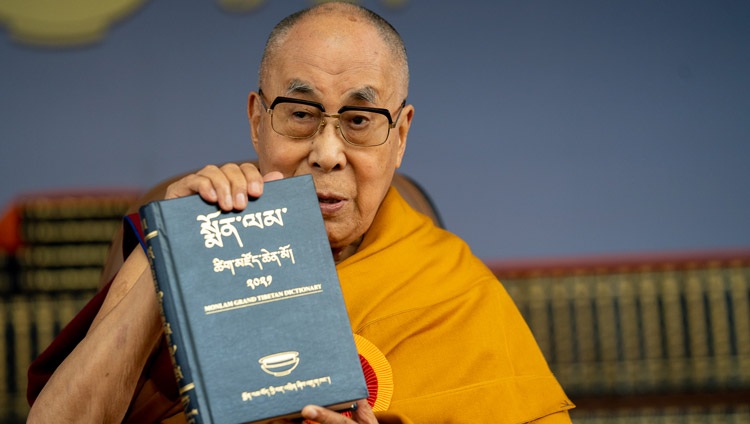 His Holiness the Dalai Lama holding a volume of the Monlam Grand Tibetan Dictionary and the dictionary's launch at the Main Tibetan Temple in Dharamsala, HP, India on May 27, 2022. Photo by Tenzin Choejor His Holiness the Dalai Lama holding a volume of the Monlam Grand Tibetan Dictionary and the dictionary's launch at the Main Tibetan Temple in Dharamsala, HP, India on May 27, 2022. Photo by Tenzin Choejor