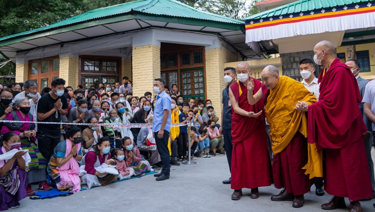 Hia Holiness the Dalai Lama waving to the crowd gathered in the Main Tibetan Temple courtyard as he arrives for the first day of his two day teaching in Dharamsala, HP, India on June 13, 2022. Photo by Tenzin Choejor Hia Holiness the Dalai Lama waving to the crowd gathered in the Main Tibetan Temple courtyard as he arrives for the first day of his two day teaching in Dharamsala, HP, India on June 13, 2022. Photo by Tenzin Choejor