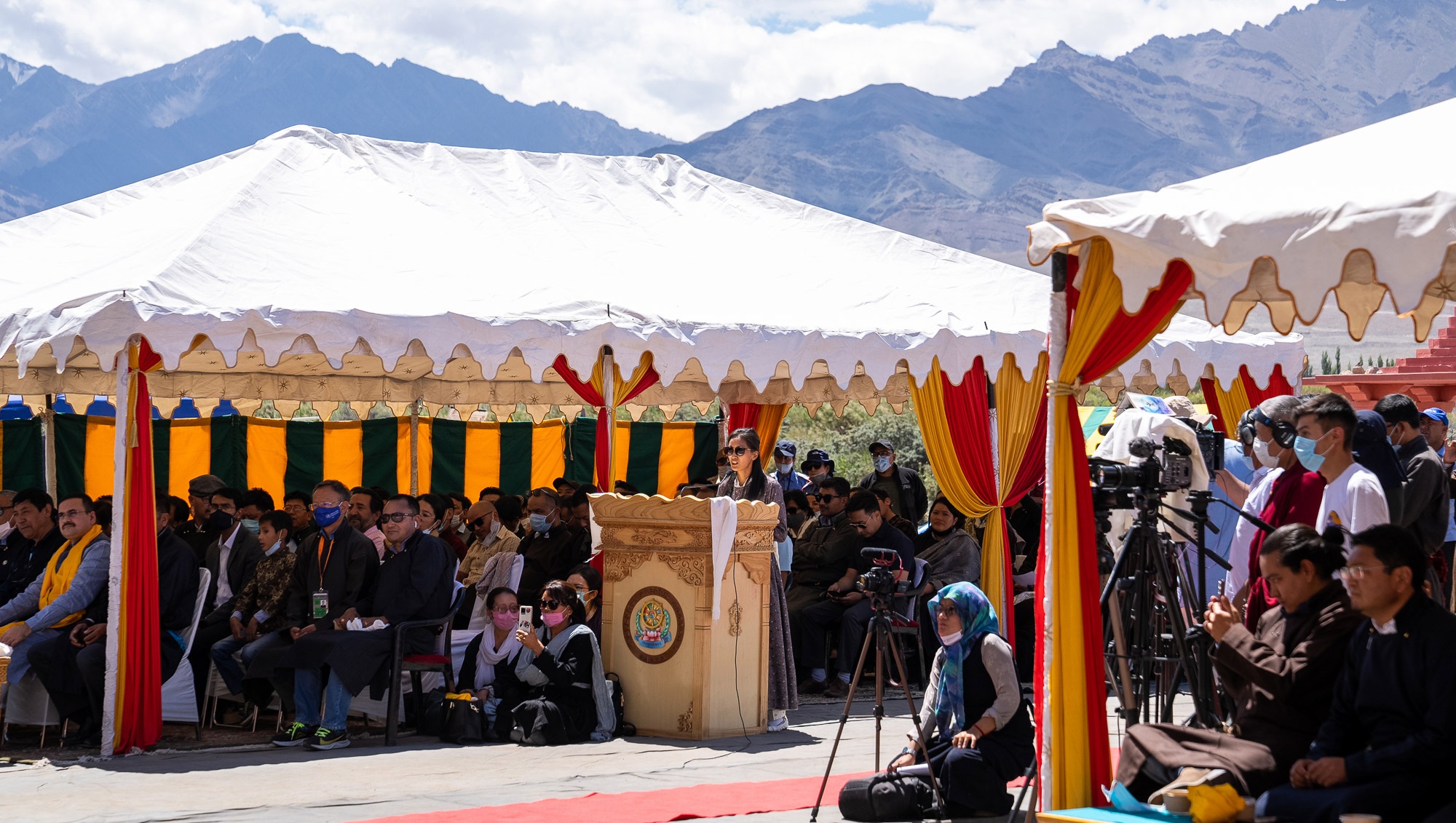 His Holiness the Dalai Lama being introduced to the audience gathered to hear him speak before a luncheon organized by the Ladakh Autonomous Hill Development Council (LAHDC) at Sindhu Ghat in Leh, Ladakh, UT, India on August 23, 2022. Photo by Tenzin Choejor His Holiness the Dalai Lama being introduced to the audience gathered to hear him speak before a luncheon organized by the Ladakh Autonomous Hill Development Council (LAHDC) at Sindhu Ghat in Leh, Ladakh, UT, India on August 23, 2022. Photo by Tenzin Choejor