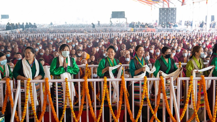Tibetan performers singing and dancing as Gaden Tri Rinpoché reads a tribute to His Holiness the Dalai Lama during the Long Life Prayer at the Kalachakra Teaching Ground in Bodhgaya, Bihar, India on January 1, 2023. Photo by Tenzin Choejor