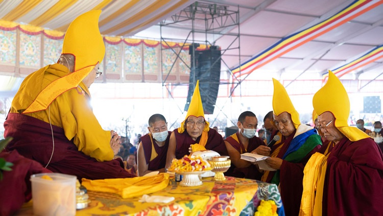 Gaden Tri Rinpoché reading a tribute reviewing His Holiness the Dalai Lama’s life and requested him to live long during the Long Life Prayer at the Kalachakra Teaching Ground in Bodhgaya, Bihar, India on January 1, 2023. Photo by Tenzin Choejor