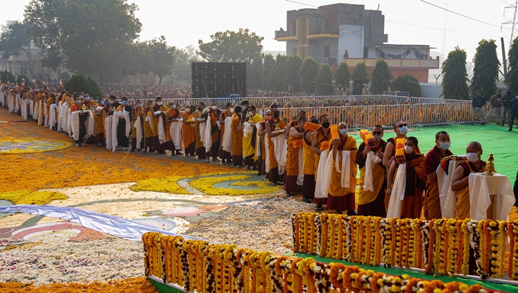 Members of the Nyingma Tradition lined up holding offerings to present to His Holiness the Dalai Lama during Long Life Prayers at Palyul Namdroling Monastery in Bodhgaya, Bihar, India on January 18, 2023. Photo by Tenzin Choejor Members of the Nyingma Tradition lined up holding offerings to present to His Holiness the Dalai Lama during Long Life Prayers at Palyul Namdroling Monastery in Bodhgaya, Bihar, India on January 18, 2023. Photo by Tenzin Choejor