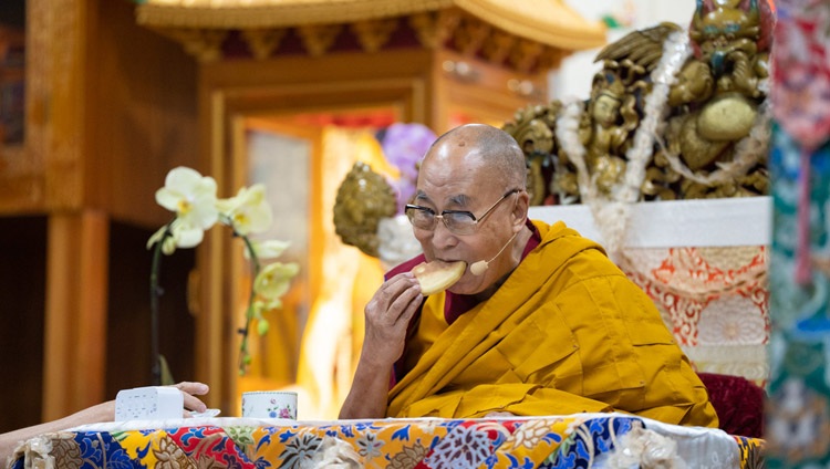 His Holiness the Dalai Lama enjoying some bread on the first day of his teachings for Tibetan Youth at the Main Tibetan Temple in Dharamsala, HP, India on May 30, 2023. Photo by Tenzin Choejor His Holiness the Dalai Lama enjoying some bread on the first day of his teachings for Tibetan Youth at the Main Tibetan Temple in Dharamsala, HP, India on May 30, 2023. Photo by Tenzin Choejor