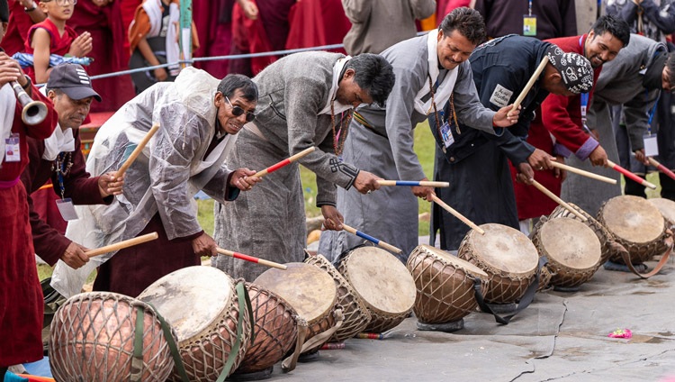A group of Ladakhi drummers playing as His Holiness the Dalai Lama departs for his residence at the conclusion of the second day of teachings at the Shewatsel Teaching Ground in Leh, Ladakh, India on July 23, 2023. Photo by Tenzin Choejor A group of Ladakhi drummers playing as His Holiness the Dalai Lama departs for his residence at the conclusion of the second day of teachings at the Shewatsel Teaching Ground in Leh, Ladakh, India on July 23, 2023. Photo by Tenzin Choejor