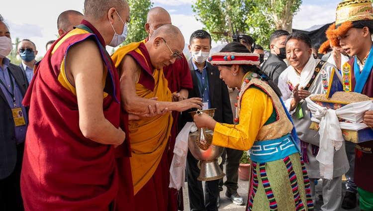 His Holiness the Dalai Lama being offered a traditional welcome as he arrives for his talk to the Tibetan community of Ladakh at the Tibetan Children's Village School (TCV) Choglamsar in Leh, Ladakh, India on July 26, 2023. Photo by Tenzin Choejor His Holiness the Dalai Lama being offered a traditional welcome as he arrives for his talk to the Tibetan community of Ladakh at the Tibetan Children's Village School (TCV) Choglamsar in Leh, Ladakh, India on July 26, 2023. Photo by Tenzin Choejor