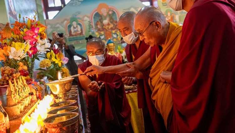 His Holiness the Dalai Lama lighting a butter lamp in the temple under the Great Buddha Statue in Stok, Leh, Ladakh, India on July 31, 2023. Photo by Tenzin Choejor His Holiness the Dalai Lama lighting a butter lamp in the temple under the Great Buddha Statue in Stok, Leh, Ladakh, India on July 31, 2023. Photo by Tenzin Choejor
