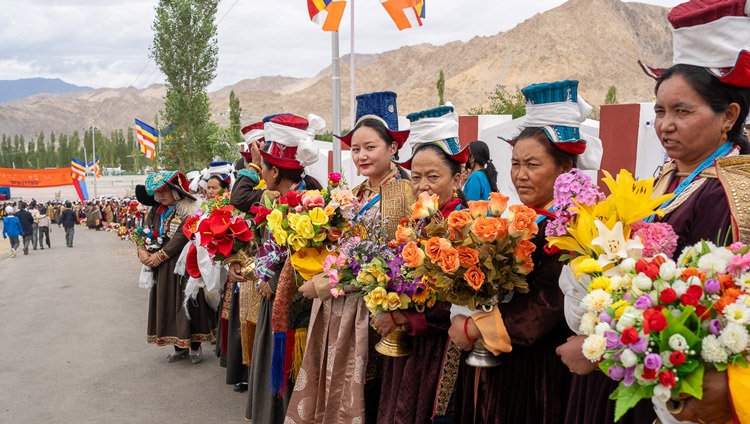 Women in traditional dress lining the road as His Holiness the Dalai Lama's motorcade makes its way to Lamdon Model Senior Secondary School in Leh, Ladakh, India on August 7, 2023. Photo by Ven Zamling Norbu Women in traditional dress lining the road as His Holiness the Dalai Lama's motorcade makes its way to Lamdon Model Senior Secondary School in Leh, Ladakh, India on August 7, 2023. Photo by Ven Zamling Norbu