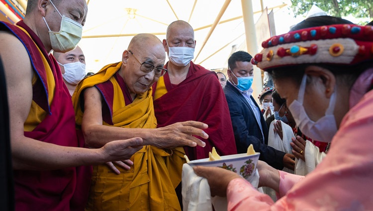 His Holiness the Dalai Lama being offered a traditional welcoming 'Chema Changphu' as he arrives at the Main Tibetan Temple courtyard to attend at long life prayers offered to him by the Institute of Buddhist Dialectics, members of Sera Jé Hardong Khangtsen, the Tibetan Chamber of Commerce and Lha Ngam Phun Sum in Dharamsala, HP, India on October 25, 2023. Photo by Tenzin Choejor His Holiness the Dalai Lama being offered a traditional welcoming 'Chema Changphu' as he arrives at the Main Tibetan Temple courtyard to attend at long life prayers offered to him by the Institute of Buddhist Dialectics, members of Sera Jé Hardong Khangtsen, the Tibetan Chamber of Commerce and Lha Ngam Phun Sum in Dharamsala, HP, India on October 25, 2023. Photo by Tenzin Choejor