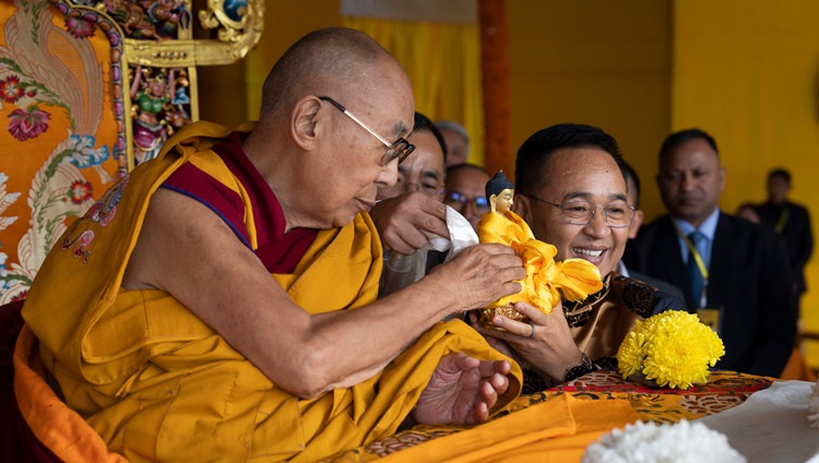 His Holiness the Dalai Lama offering a statue of the Buddha to Sikkim Chief Minister Shri Prem Singh Tamang at the start of teachings at Paljor Stadium in Gangtok, Sikkim, India on December 12, 2023. Photo by Tenzin Choejor His Holiness the Dalai Lama offering a statue of the Buddha to Sikkim Chief Minister Shri Prem Singh Tamang at the start of teachings at Paljor Stadium in Gangtok, Sikkim, India on December 12, 2023. Photo by Tenzin Choejor