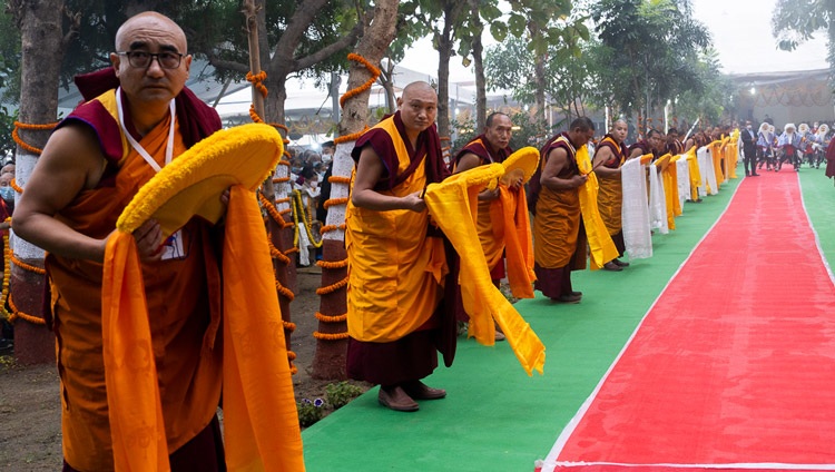 Monks lining the drive at the Kalachakra Ground waiting for His Holiness the Dalai Lama's arrive to attend a Long Life Ceremony in Bodhgaya, Bihar, India on January 1, 2024. Photo by Tenzin Choejor Monks lining the drive at the Kalachakra Ground waiting for His Holiness the Dalai Lama's arrive to attend a Long Life Ceremony in Bodhgaya, Bihar, India on January 1, 2024. Photo by Tenzin Choejor