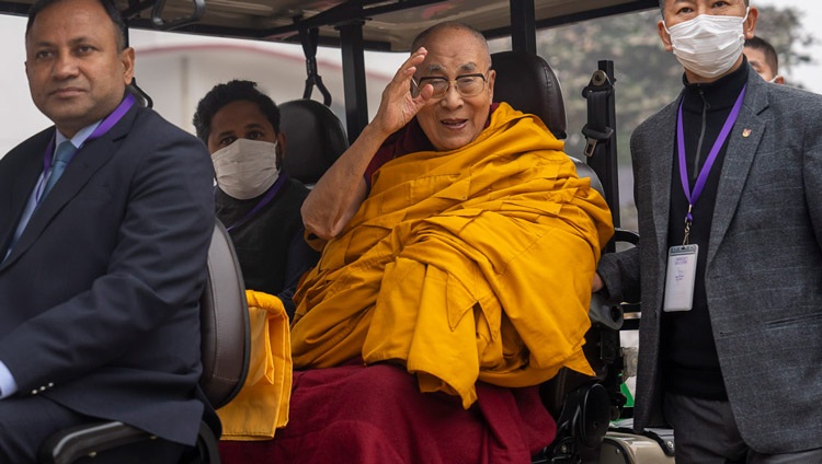 His Holiness the Dalai Lama waving to the crowd as he rides a golf-cart back to the Tibetan Monastery at the conclusion of the Long Life Ceremony at the Kalachakra Ground in Bodhgaya, Bihar, India on January 1, 2024. Photo by Tenzin Choejor His Holiness the Dalai Lama waving to the crowd as he rides a golf-cart back to the Tibetan Monastery at the conclusion of the Long Life Ceremony at the Kalachakra Ground in Bodhgaya, Bihar, India on January 1, 2024. Photo by Tenzin Choejor