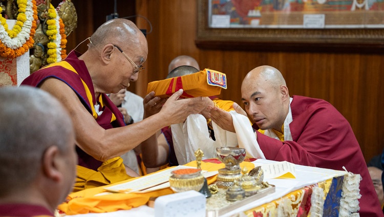 Kalu Rinpoché offering representations of body, speech and mind to His Holiness the Dalai Lama at the start of the Mahakala permission at the Main Tibetan Temple in Dharamsala, HP, India on May 18, 2024. Photo by Tenzin Choejor Kalu Rinpoché offering representations of body, speech and mind to His Holiness the Dalai Lama at the start of the Mahakala permission at the Main Tibetan Temple in Dharamsala, HP, India on May 18, 2024. Photo by Tenzin Choejor