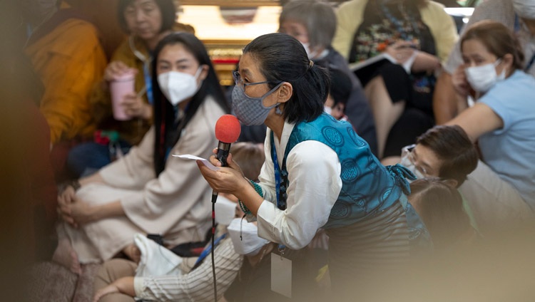A member of the audience asking His Holiness the Dalai Lama a question during the teaching for South-east Asian Buddhists at the Main Tibetan Temple in Dharamsala, HP, India on September 12, 2024. Photo by Tenzin Choejor A member of the audience asking His Holiness the Dalai Lama a question during the teaching for South-east Asian Buddhists at the Main Tibetan Temple in Dharamsala, HP, India on September 12, 2024. Photo by Tenzin Choejor