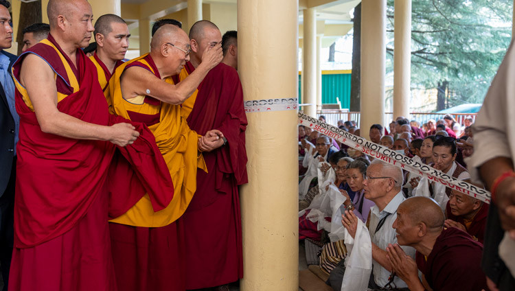 His Holiness the Dalai Lama greeting members of the crowd on his way to join in the recitation of prayers to the Medicine Buddha at the Main Tibetan Temple in Dharamsala, HP, India on June 15, 2025. Photo by Tenzin Choejor