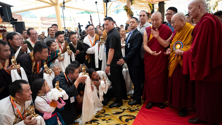 His Holiness the Dalai Lama greeting members of the crowd as he arrives to attend celebrations in honor of his 90th birthday according to the Tibetan Lunar calendar at the Main Tibetan Temple courtyard in Dharamsala, HP, India on June 30, 2025. Photo by Ven Zamling Norbu