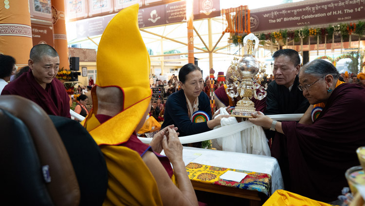 His Holiness the Dalai Lama being presented an award symbolizing him as the “Peerless Spiritual Teacher of the Twenty-first Century” during celebrations in honor of his 90th birthday according to the Tibetan lunar calendar at the Main Tibetan Temple courtyard in Dharamsala, HP, India on June 30, 2025. Photo by Tenzin Choejor