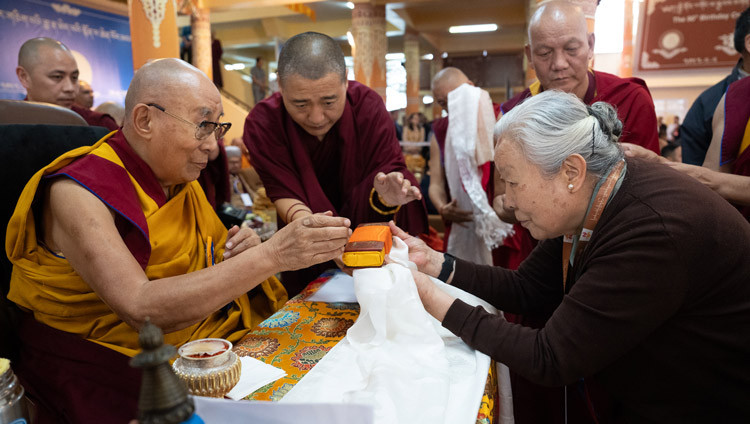Kasur Jetsun Pema presenting traditional offerings to His Holiness the Dalai lama during celebrations in honor of his 90th birthday according to the Tibetan lunar calendar at the Main Tibetan Temple courtyard in Dharamsala, HP, India on June 30, 2025. Photo by Tenzin Choejor