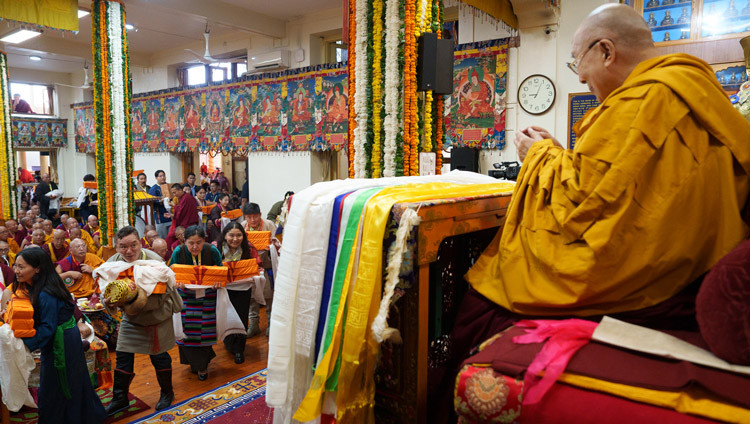 A procession of members of CTA staff carrying offerings for His Holiness the Dalai Lama during the Long Life Prayers at the Main Tibetan Temple in Dharamsala, HP, India on July 5, 2025. Photo by Tenzin Choejor