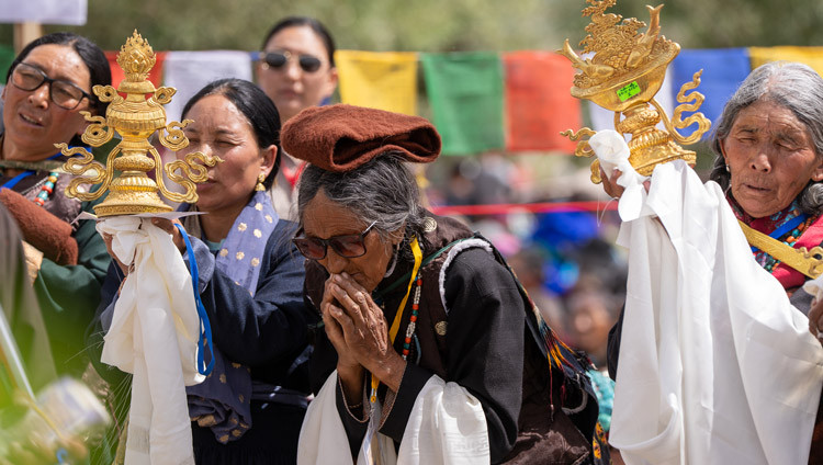 Members of the community holding offerings for His Holiness the Dalai Lama during Long Life Prayers offered to him by the people of Ladakh at the Kalachakra Ground in Padum, Zanskar, Ladakh, India on July 23, 2025. Photo by Tenzin Choejor