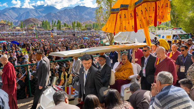 His Holiness the Dalai Lama riding to the pavilion at the Kalachakra Teaching Ground in Leh, Ladakh, India on August 16, 2025. Photo by Tenzin Choejor