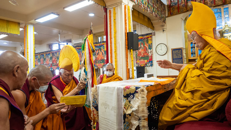 Samdhong Rinpoche offering a long-life arrow during the prayers for His Holiness the Dalai Lama's long life at the Main Tibetan Temple in Dharamsala, HP, India on October 8, 2025. Photo by Tenzin Choejor